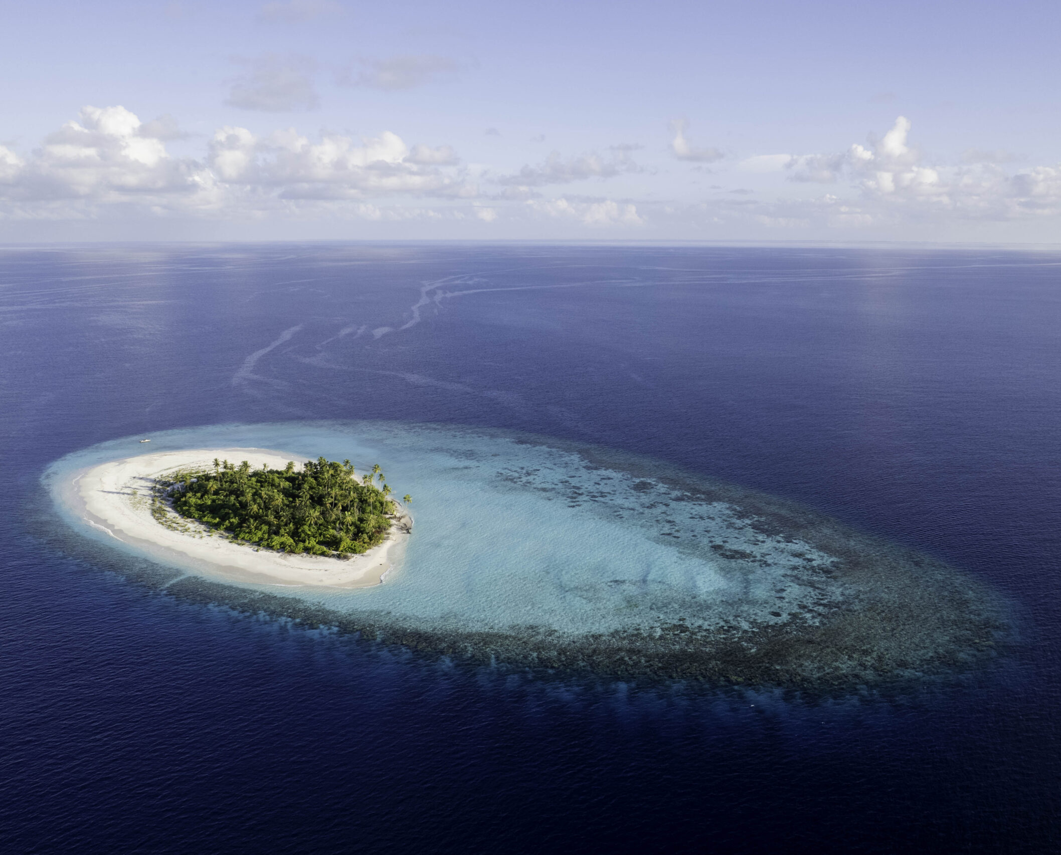 Desert island survival experience in Maldives aerial view