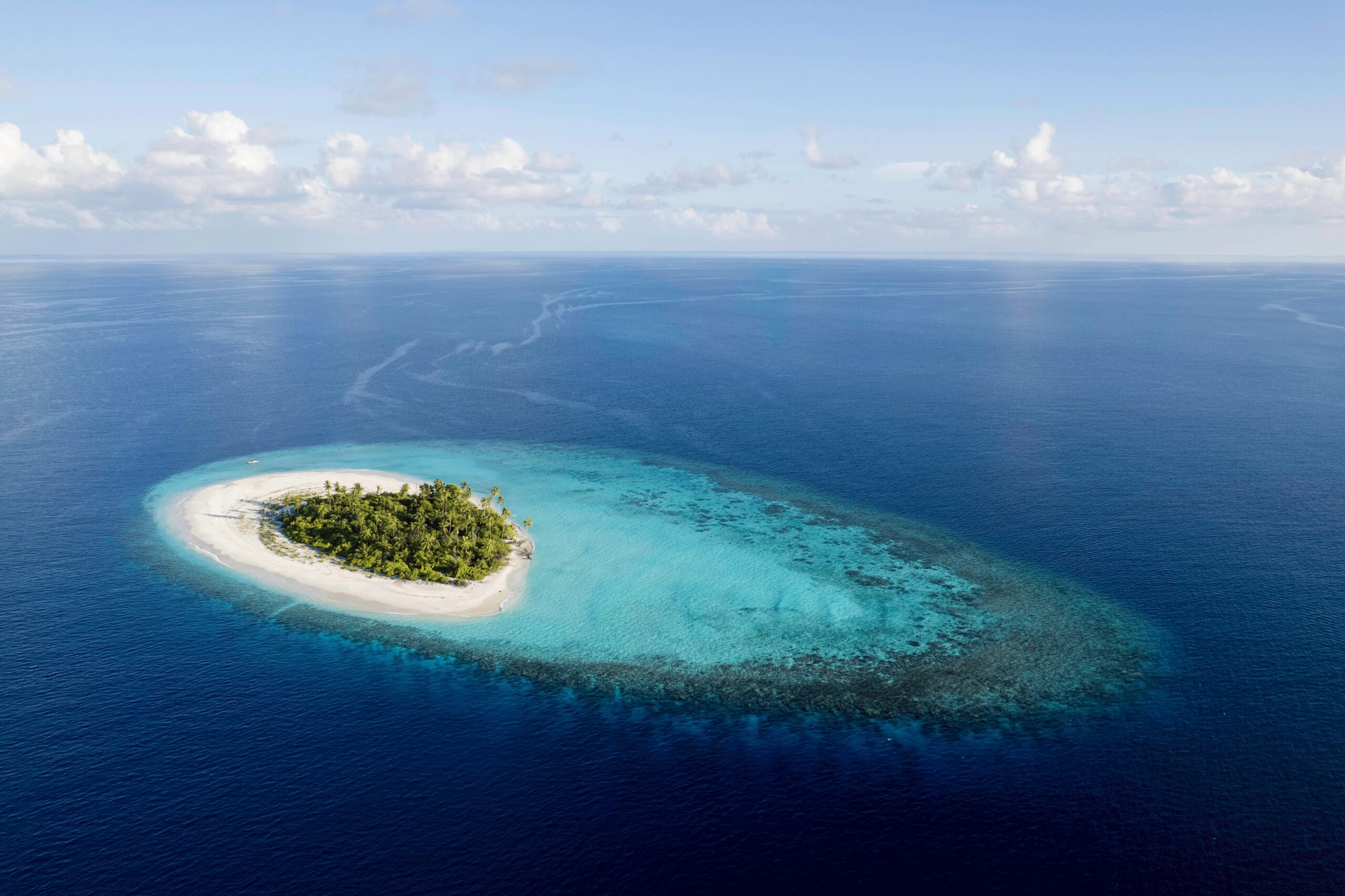Desert island survival experience in Maldives aerial view